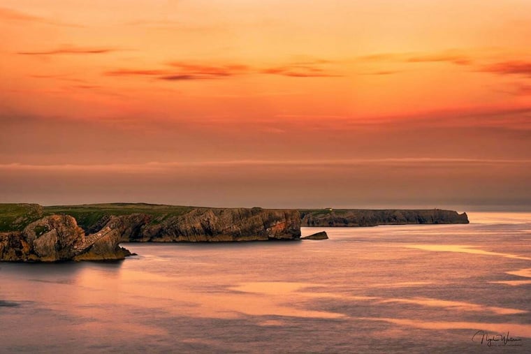 Three peninsulas Pembrokeshire coastal path at sunset in Wales