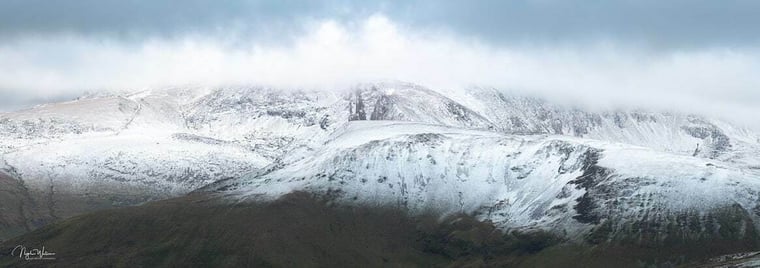 Wintery Mountain scene of the Snowdon Massif covered in snow