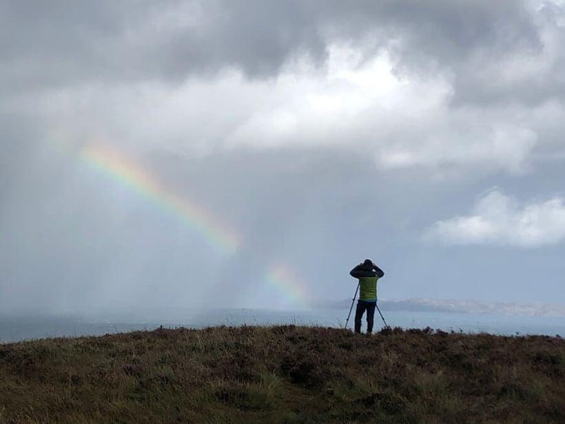 Photographing a rainbow in a storm